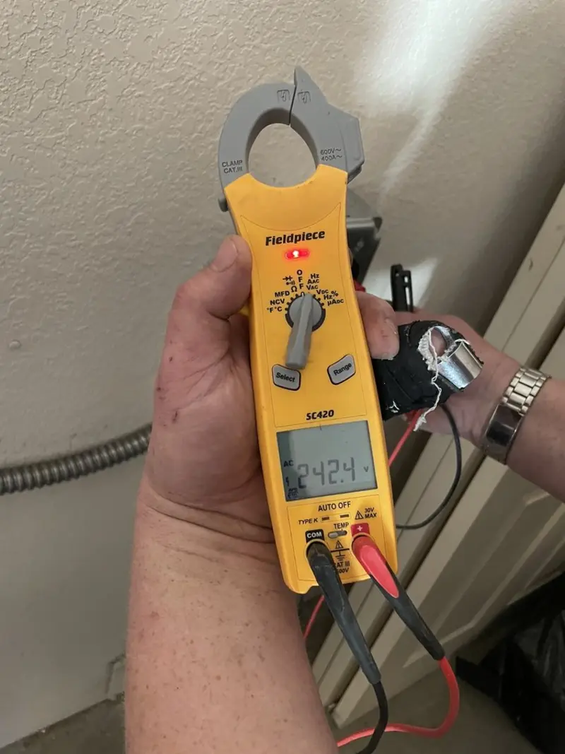Voltage testing with clamp meter during Electrical Installation Services in Miami Gardens